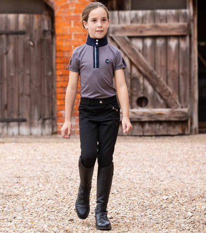 Premier Equine Brava Girls Black Riding Breeches: Equestrian Apparel with Full Seat Gel for Young Riders. Equiflair.