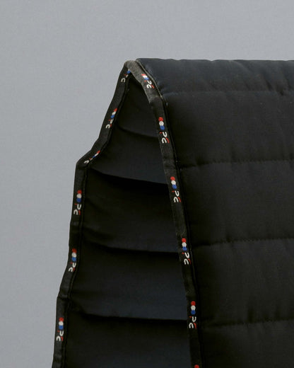 Premier Equine Buster Reversible Saddle Pad - Black. Equestrian saddle pad, close up view.