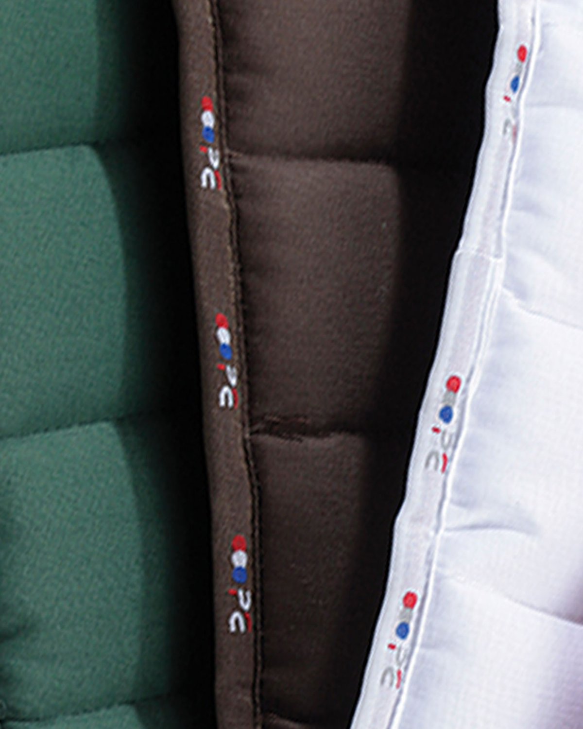 Premier Equine Buster Reversible Saddle Pad - Brown, Green, White. Durable equestrian pad.