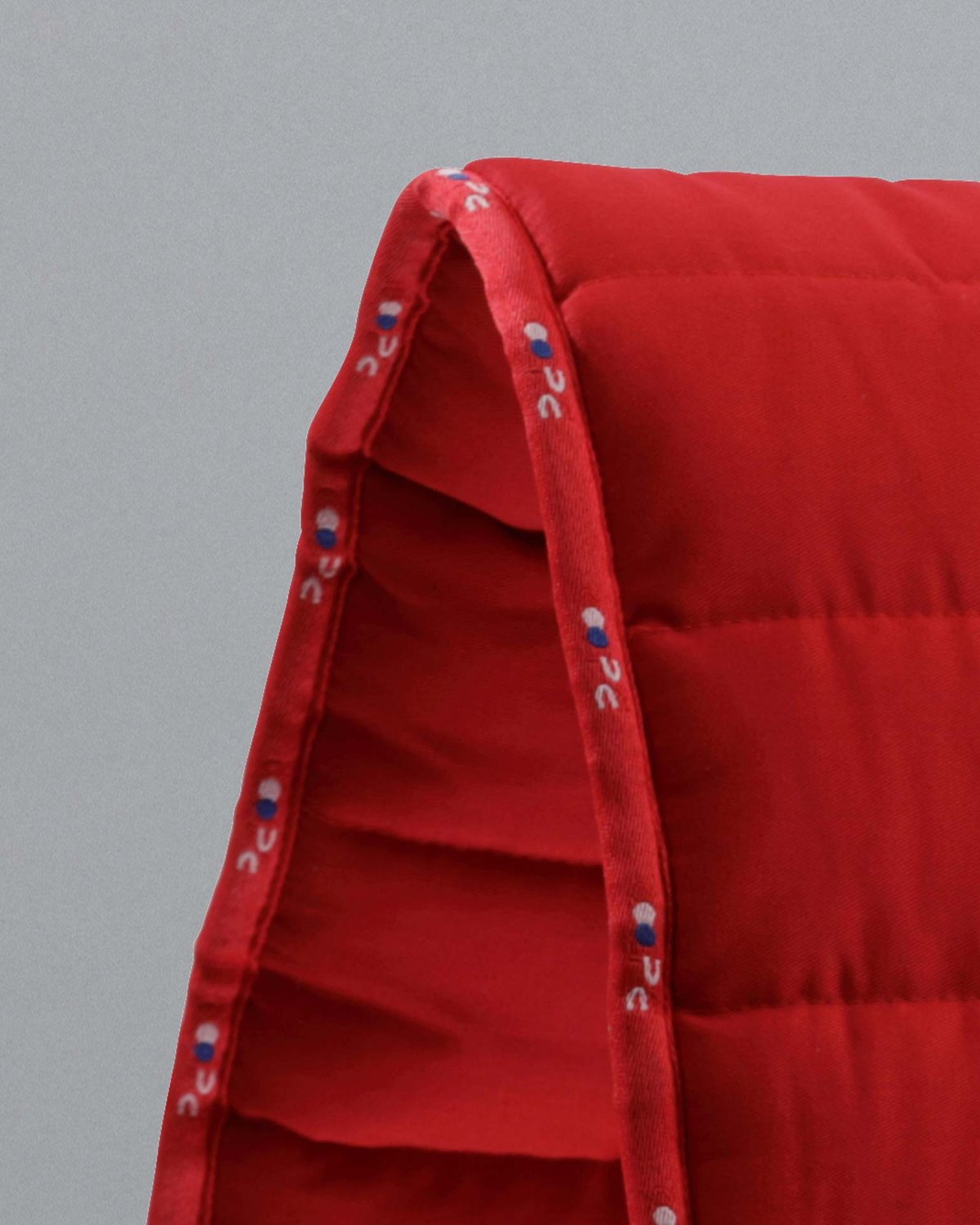Premier Equine Buster Reversible Saddle Pad - Red: High-quality reversible saddle pad for comfortable horse riding.