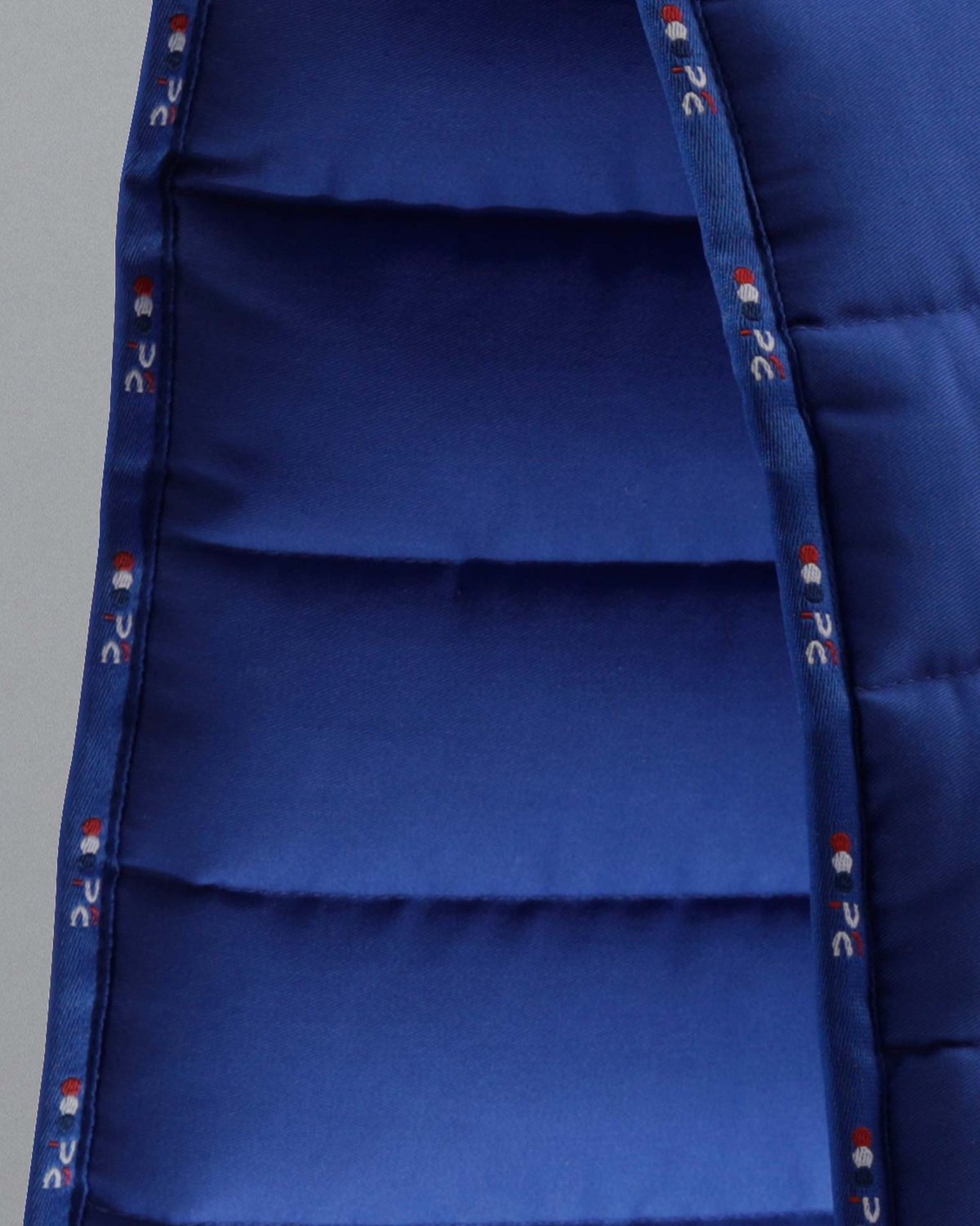 PREMIER EQUINE BUSTER Reversible Saddle Pad - Royal Blue. Quilted work pad with airflow, non-slip design.