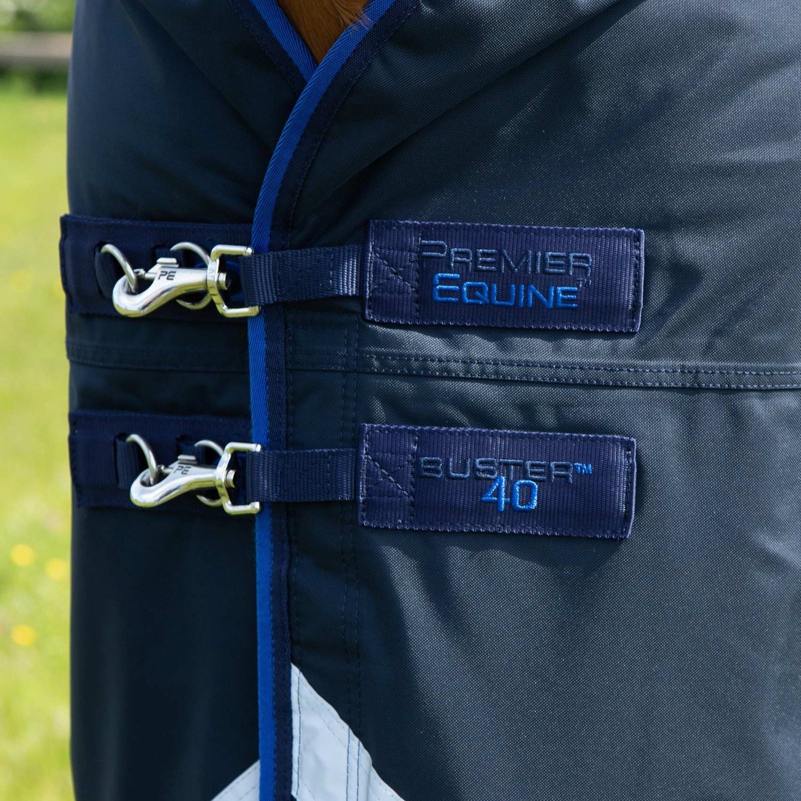 PREMIER EQUINE BUSTER 40G Turnout Rug - Navy horse blanket with buckles and neck cover attachment.