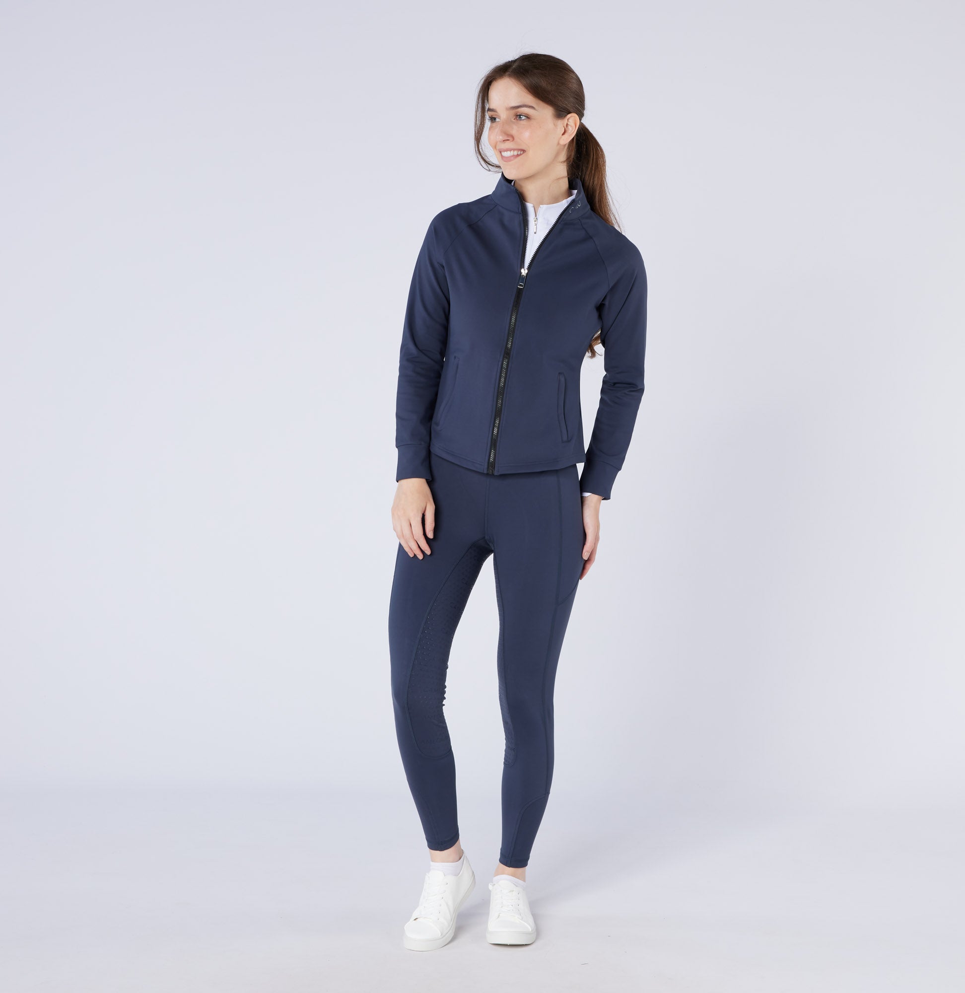 Woman in Navy Thermodry Riding Tights & Jacket | Equestrian Apparel | CAMEO | Winter Riding Clothes