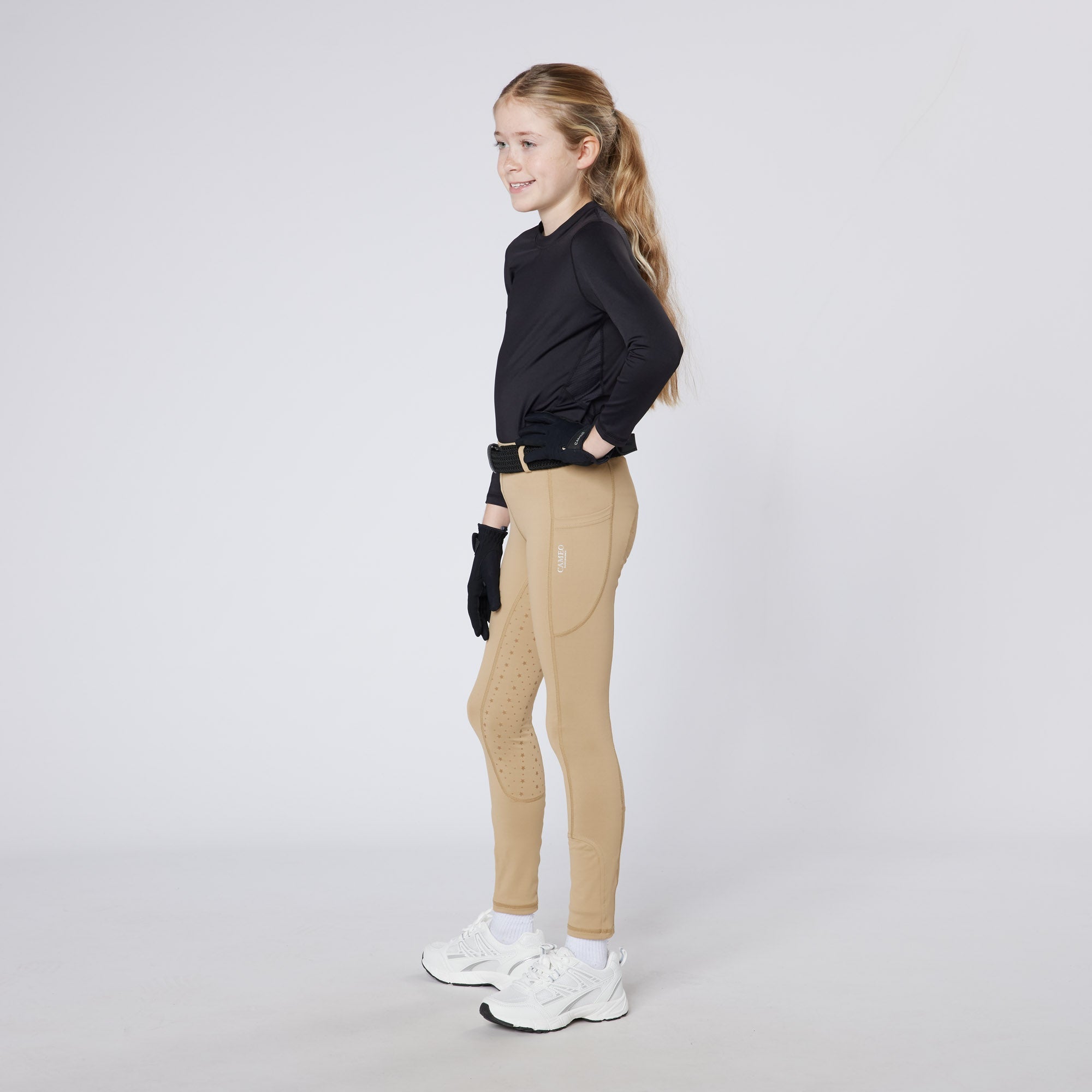 Junior Equestrian in Cameo Riding Tights: Performance, Comfort & Style - Silicone Grip & Phone Pocket. #ridingtights #equestrian #cameo