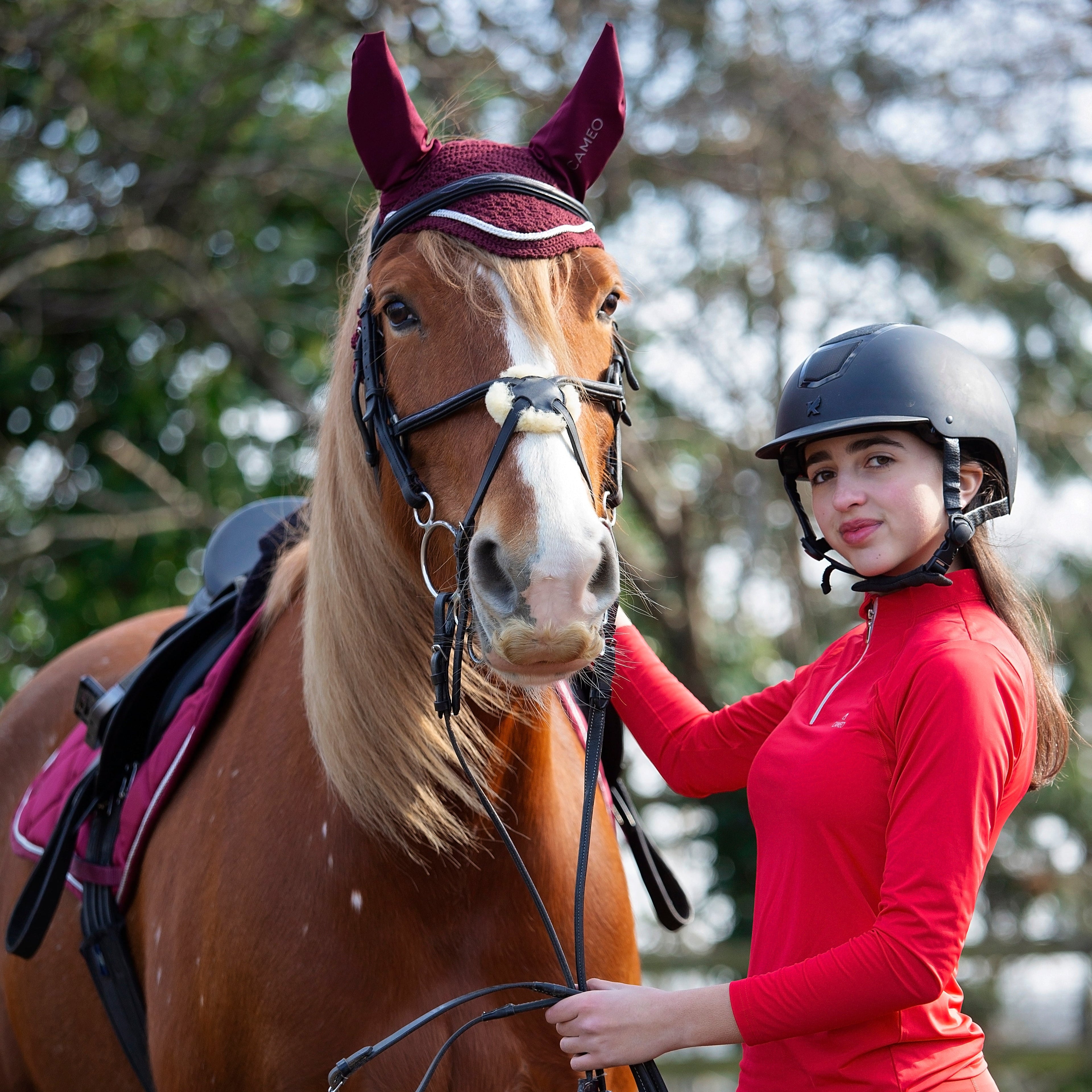 Girl & horse wearing riding gear: Cameo baselayer (Poppy Red) from Equiflair. Equestrian apparel, horse riding fashion.