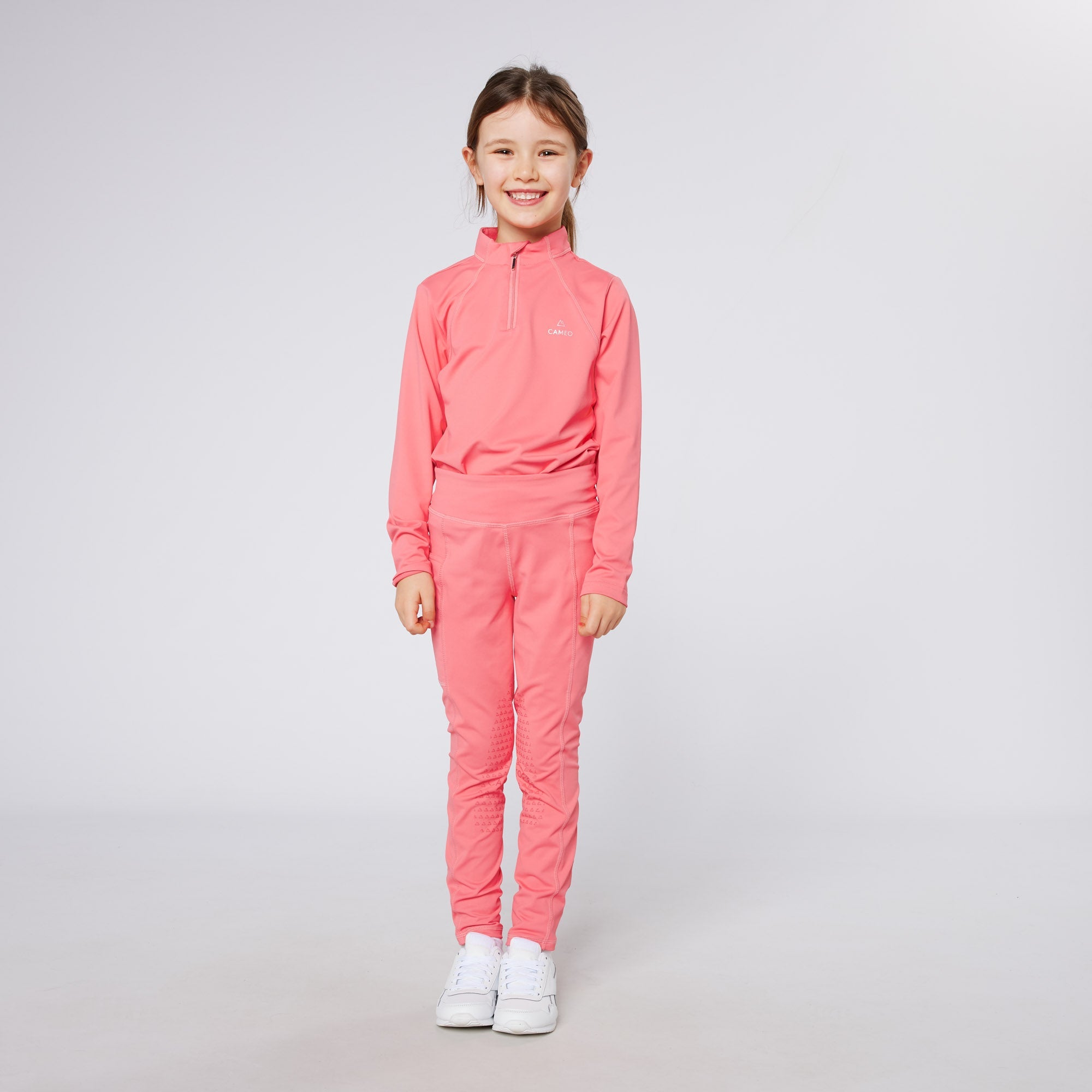 Girl in Cameo Baselayer Coral Pink Equestrian Riding Clothes | Equiflair