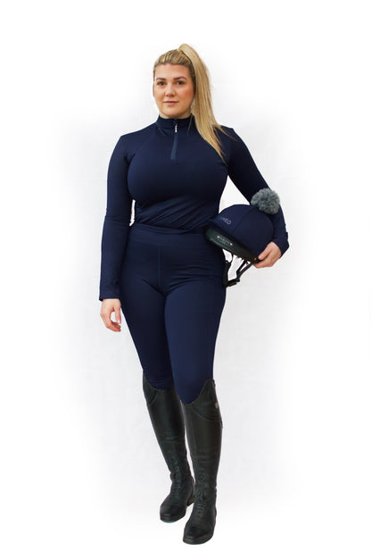 Woman in Navy Cameo Core Collection Riding Tights with Equestrian Helmet | Equiflair
