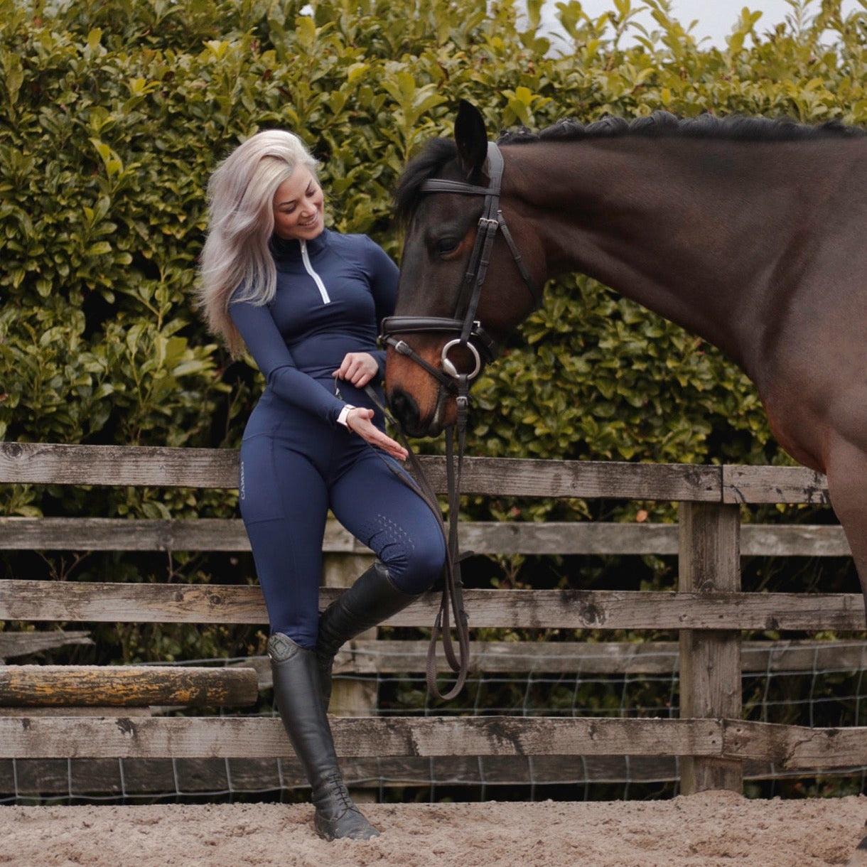 Woman in Cameo Navy Riding Tights with Horse - Equiflair Women's Equestrian Apparel