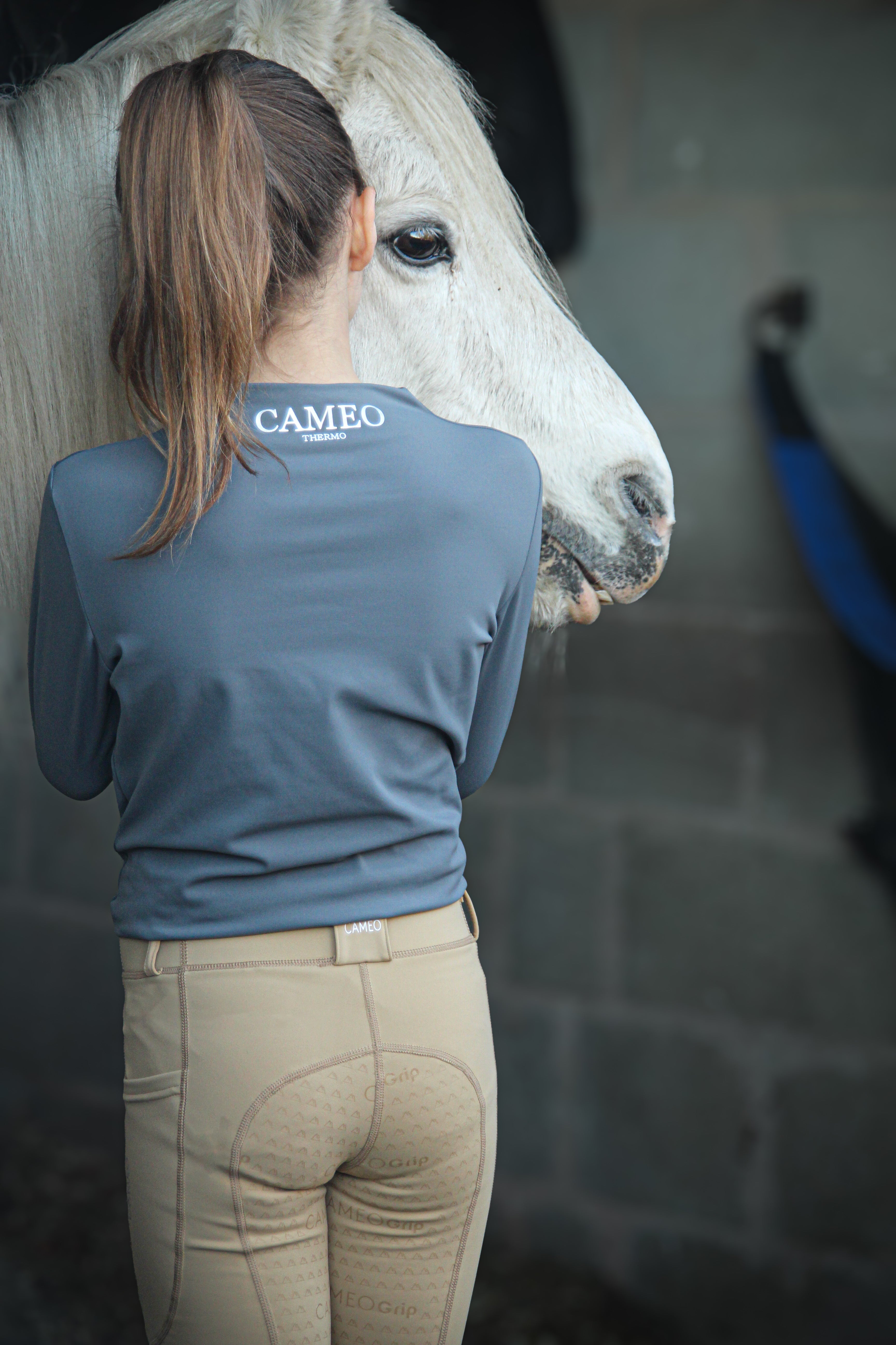 CAMEO JUNIOR THERMO TIGHTS BEIGE: Equestrian riding pants with silicone grip. Woman with horse. Equiflair riding apparel.