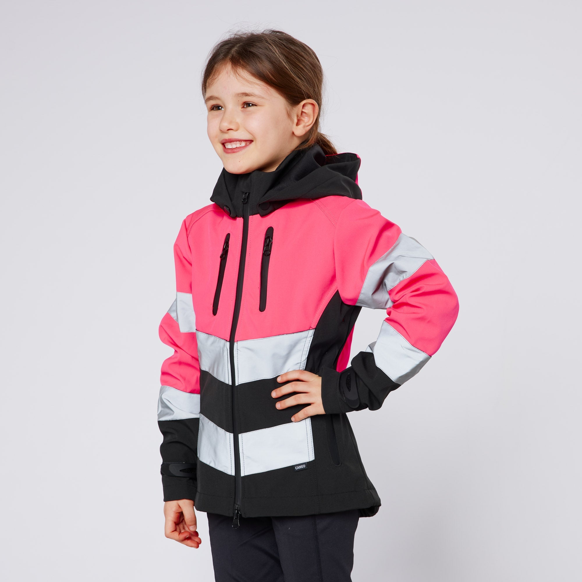 CAMEO Junior Hi Viz Safety Jacket - Girl in pink and black reflective riding jacket.
