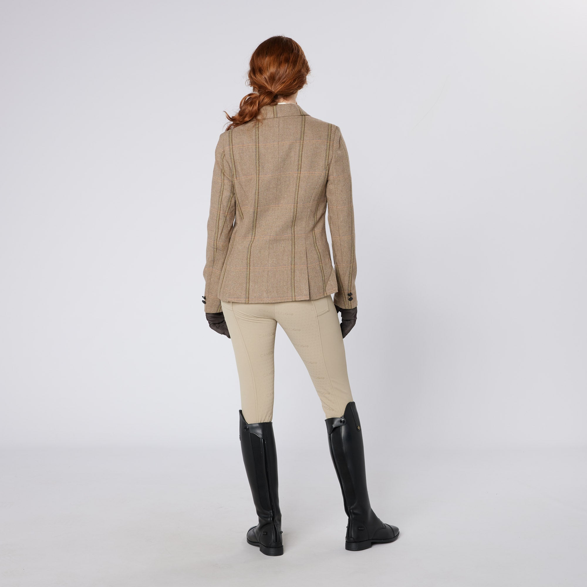 Equiflair ladies tweed show jacket. Equestrian riding apparel with fox head buttons. Green tweed show jacket from Equiflair.