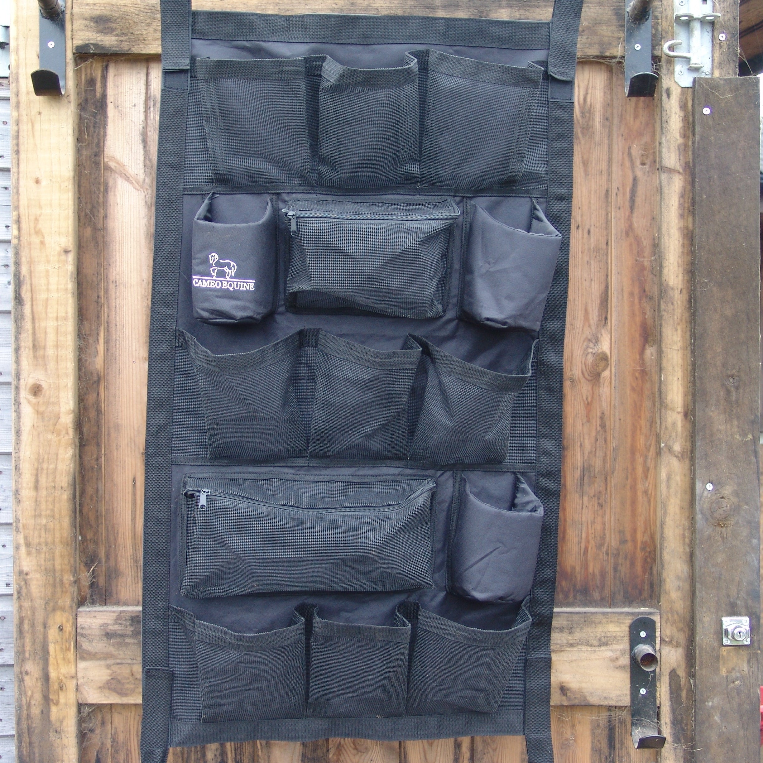 CAMEO Stable Organiser Black: Wall-mounted organizer for horse grooming supplies and accessories.