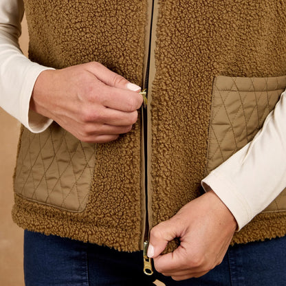 TOGGI Carney Women's reversible brown sherpa fleece gilet with quilted pockets, being zipped up