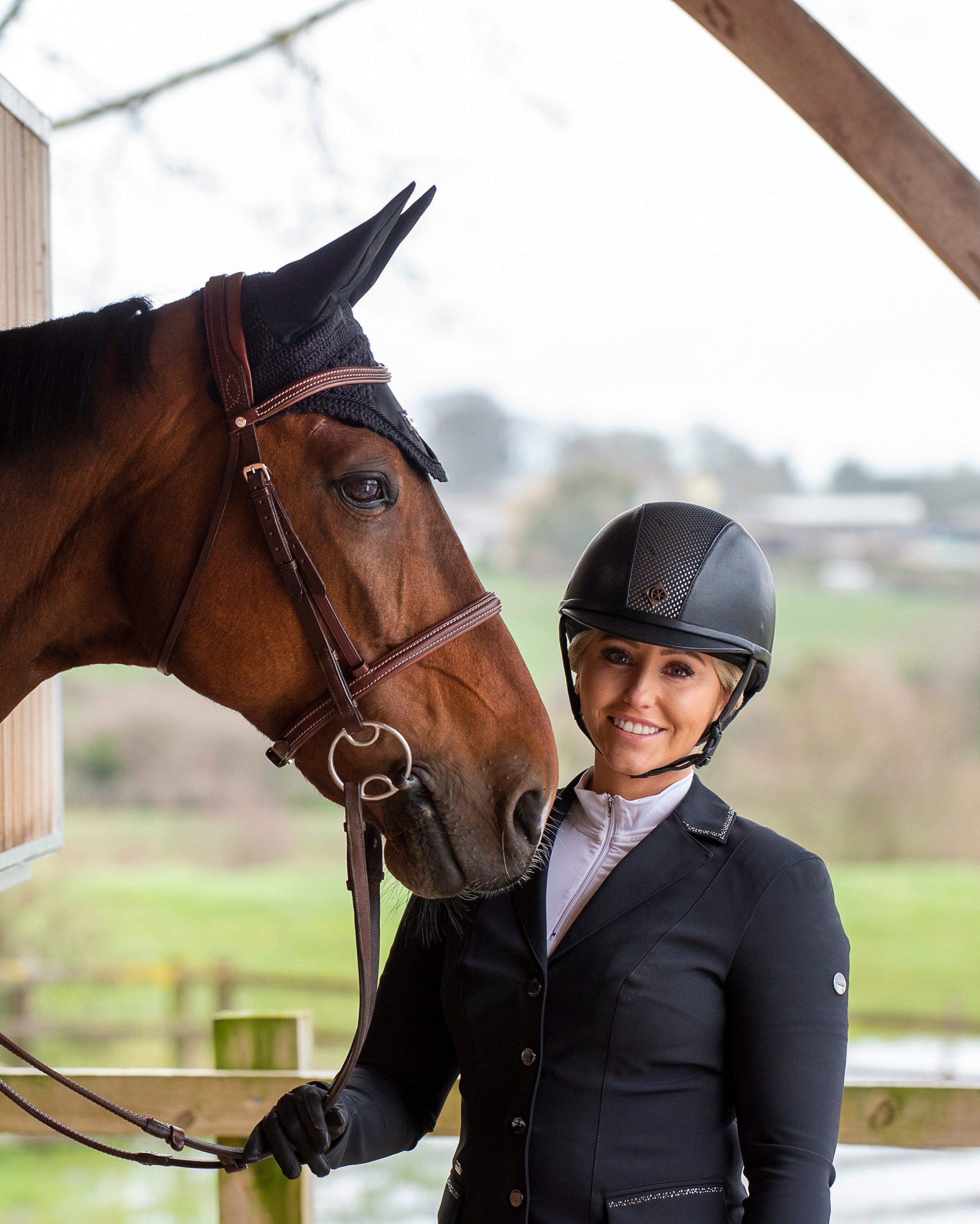 Equestrian: Horse Rider in Charles Owen Ayr8 Plus Leather Look Helmet (Black/Silver). Vegan Leather, GRpx Tech