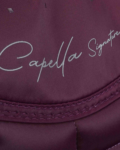 PREMIER EQUINE Capella Dressage Saddle Pad - Wine with Merino Wool. Close up of signature on luxurious quilted design.