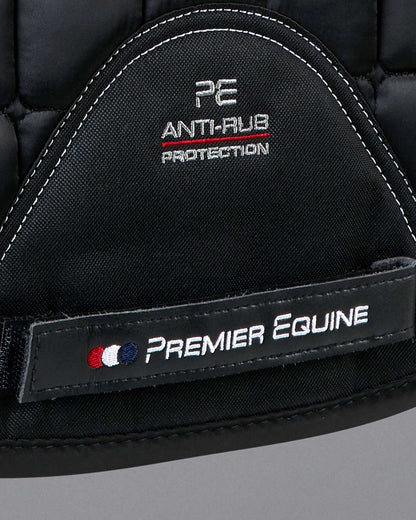 Premier Equine Anti-Rub Merino Wool Saddle Pad: Black quilted GP/Jump square with white stitching and PE branding.