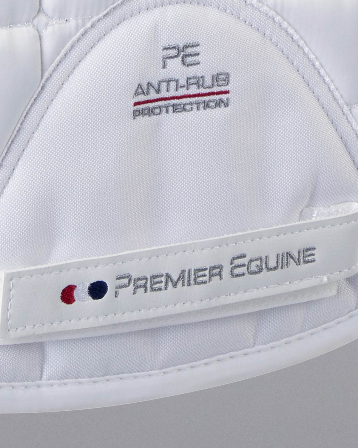 Premier Equine White Merino Wool Saddle Pad: Anti-Rub, Close Contact. Quality Equine Tack for Optimal Comfort & Protection.