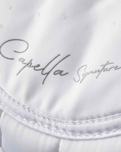 Capella Signature saddle pad detail, white quilted logo. Premier Equine brand