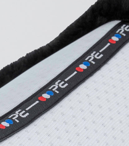 Premier Equine Airtechnology Shockproof Wool GP/Jump Square Saddle Pad - close up on black trim with brand logo