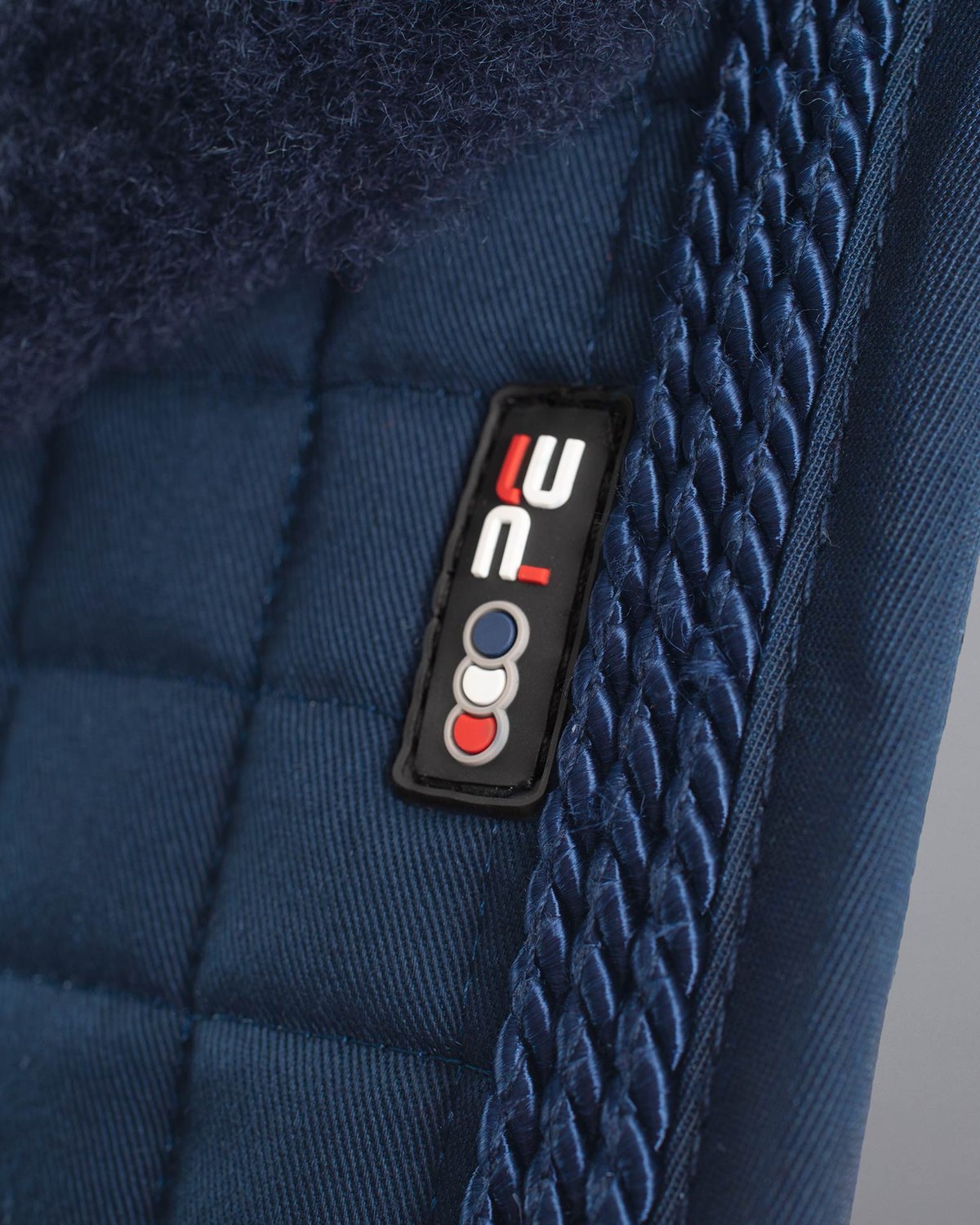 Premier Equine Dressage Saddle Pad: Navy Merino Wool, Quilted Design, Rope Trim Detail. Equestrian Equipment