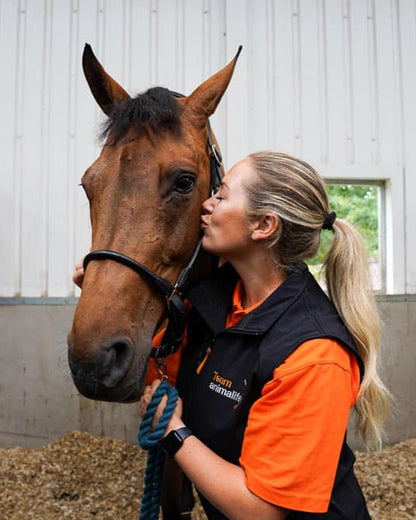 Animal Care: Woman Kissing Horse at Equiflair Stable. Equine VetroOxyshot love!