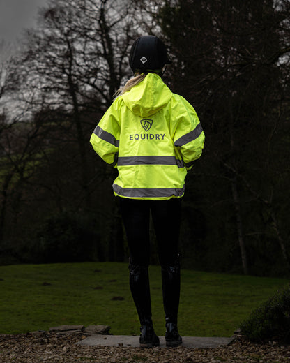 Equidry hi-vis yellow waterproof riding coat for women with reflective details.