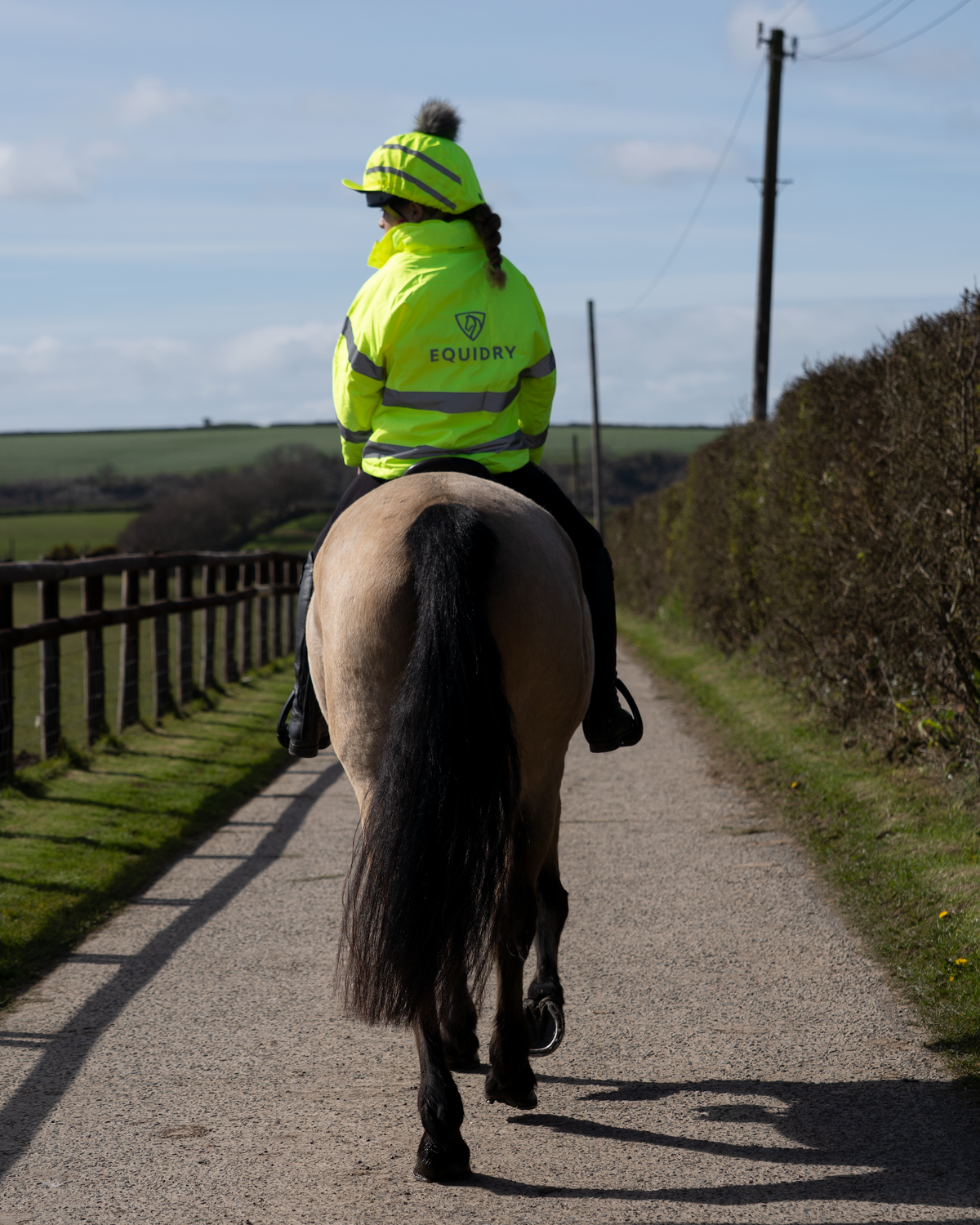 Child rider in Equidry Hi-Vis Yellow waterproof fleece lined riding coat