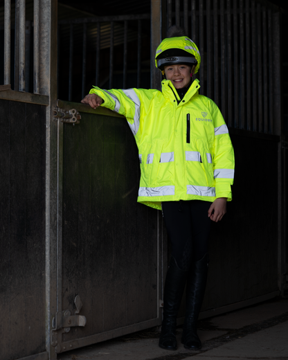 Children's yellow Equidry hi-vis waterproof riding coat for equestrian safety and visibility.