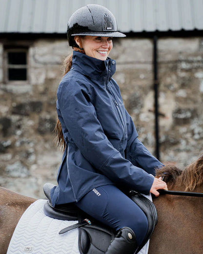 EQUIDRY IRIS Waterproof Riding Jacket Women's Navy on Horseback. Equiflair equestrian apparel.