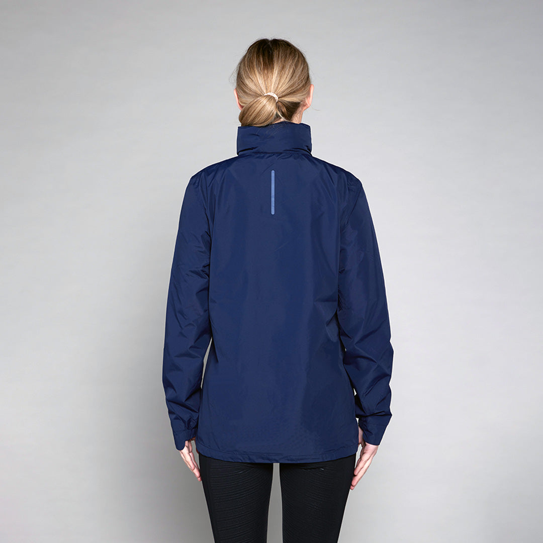 Back view of a woman wearing a navy blue TOGGI Defender Waterproof Jacket with reflective detail.