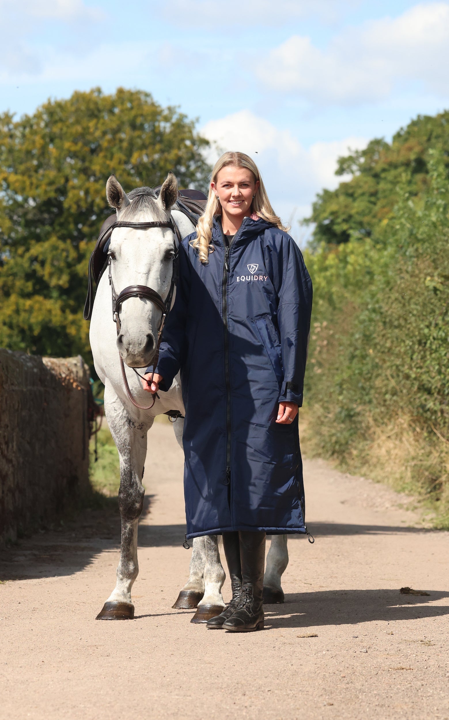 EQUIDRY waterproof horse riding raincoat All Rounder Original thick fleece Women's Navy/Pale Pink full view stood with horse