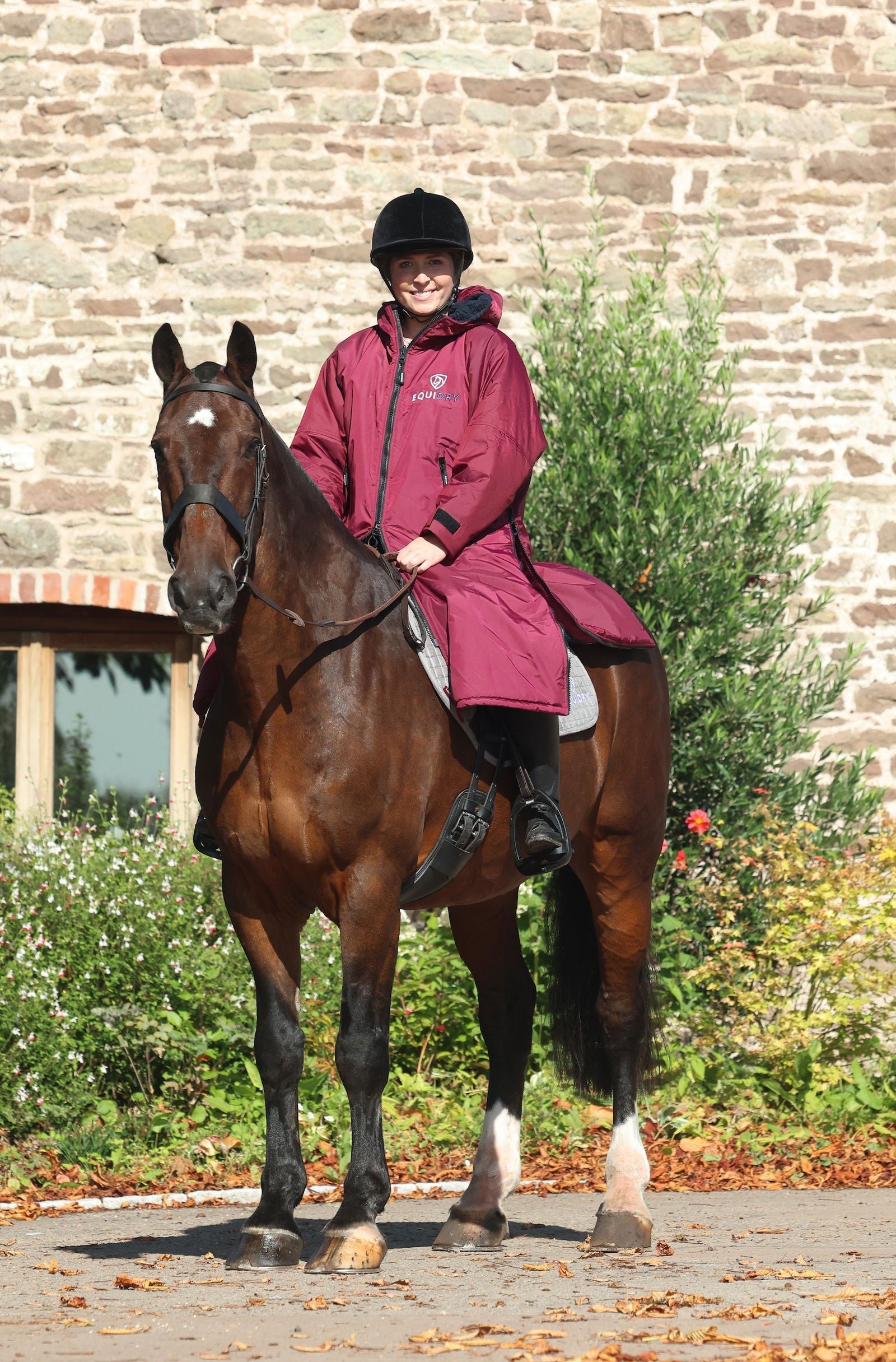 EQUIDRY waterproof horse riding raincoat All Rounder Original thick fleece Women's plum/navy on horse