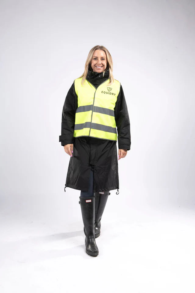 Equidry Hi Vis Vest Class 2: Woman in reflective high visibility vest and waterproof riding skirt by Equiflair