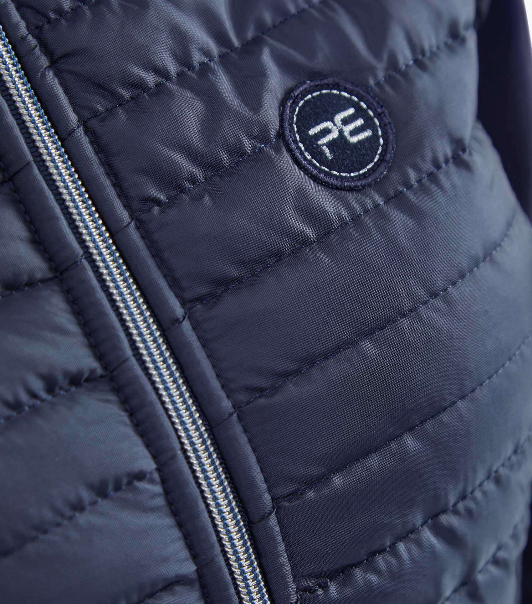 Premier Equine Navy Riding Jacket: Quilted, Technical, with 'PE' Logo. Shop Now!