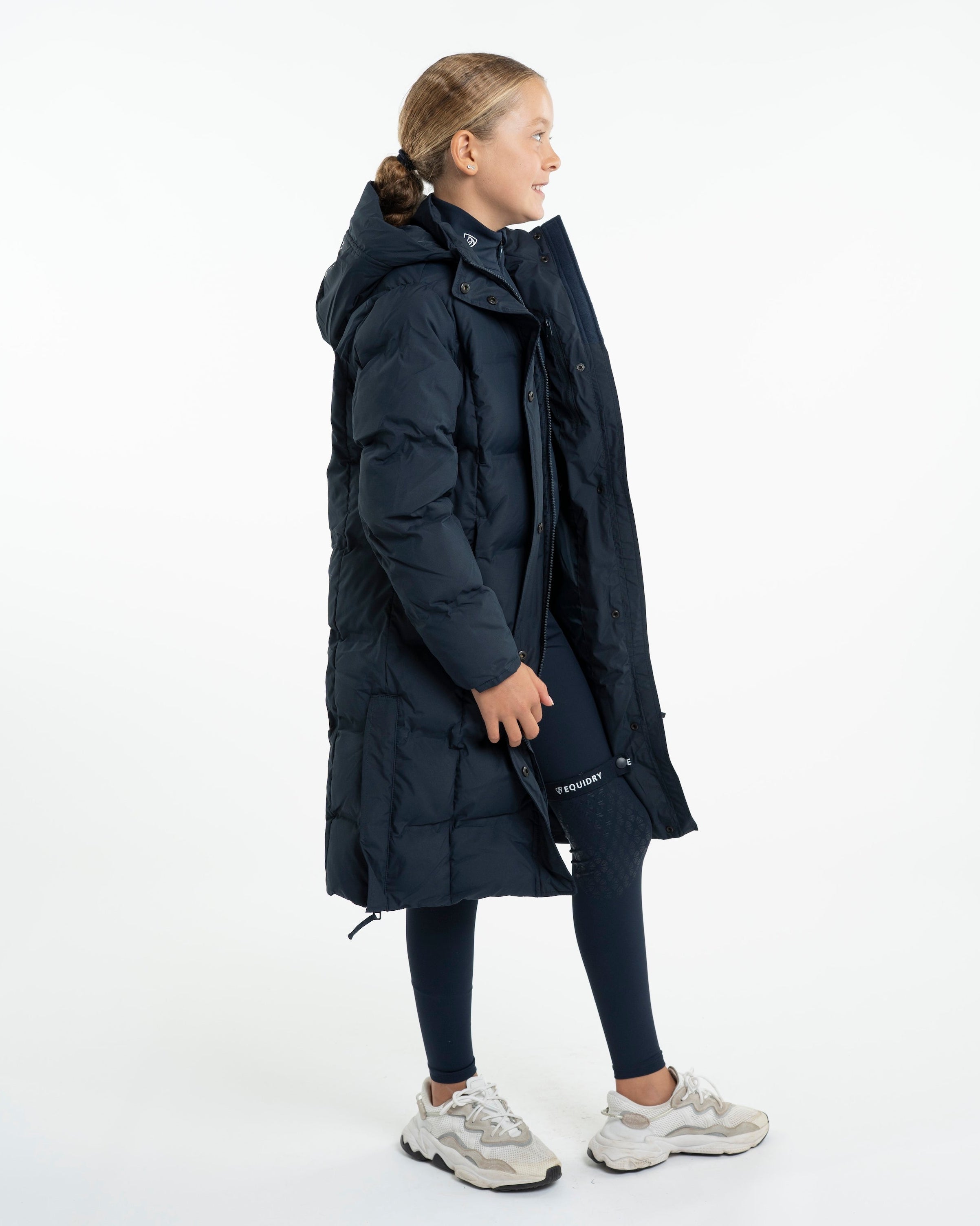 Girl in EQUIDRY THORA Waterproof Riding Puffer Coat - Navy - Equiflair