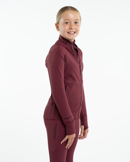 EQUIDRY Children's Water Repellent Zip Up Top - Plum. Girl wearing equestrian apparel for riding & outdoor activities.