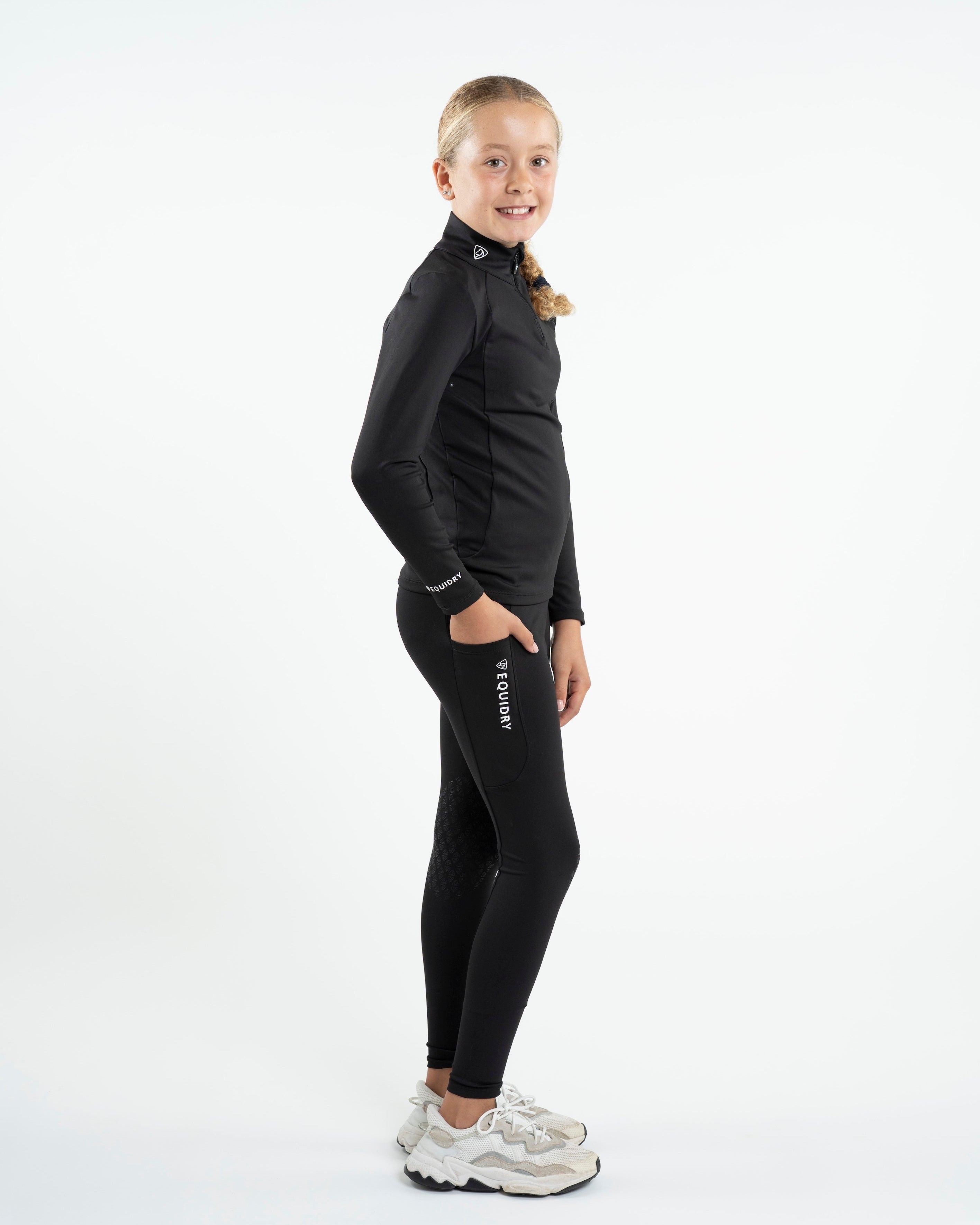 Girl in Equidry Equestrian Base Layer: Black, Water Repellent, Children's Riding Apparel