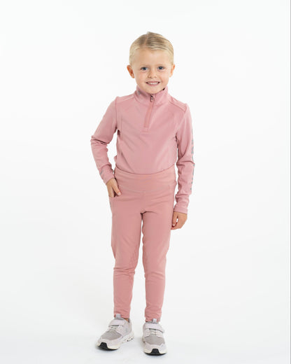 Equidry Children's Pink Water Repellent Equestrian Base Layer & Leggings by Equiflair. Young girl wearing pink horse riding clothes