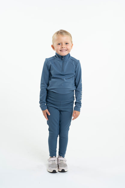 Child in Equidry Steel Blue Water Repellent Riding Leggings with Knee Grip | Equiflair