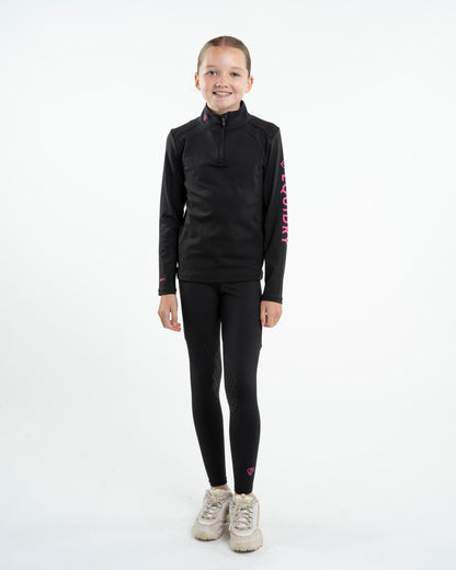 Equidry Children's Riding Leggings: Black/Pink, Water-Repellent, Knee Grip. Girl in black Equidry Leggings.