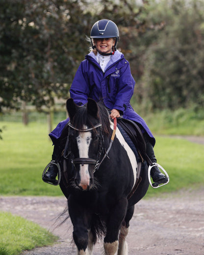 Child Horse Rider in EQUIDRY Purple Fleece Coat: Equestrian Kids' Gear, Waterproof Riding Jacket, Ponies, Horseback Riding