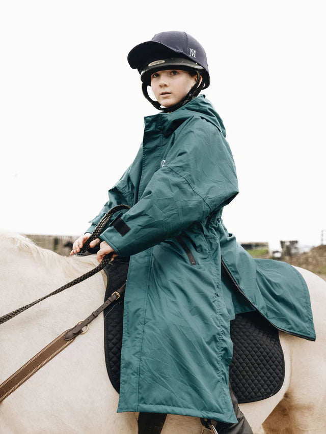 Equidry Evolution Children's Teal Riding Coat: Girl on Horseback in Waterproof Equestrian Rain Jacket
