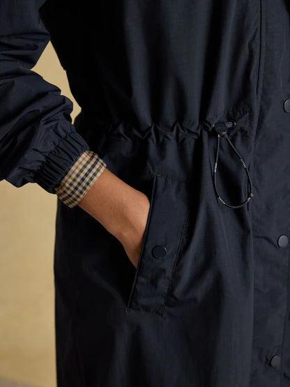 Joules Hensley Navy Waterproof Coat: Longline style, Packable hood, Hand in pocket with patterned cuff.