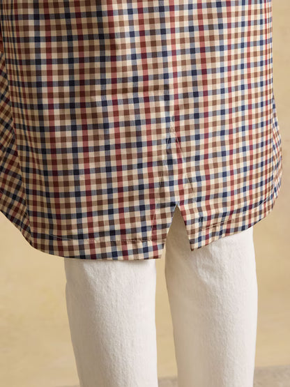 JOULES Holkham Gingham Waterproof Raincoat Detail: Plaid fabric and vent on hem.