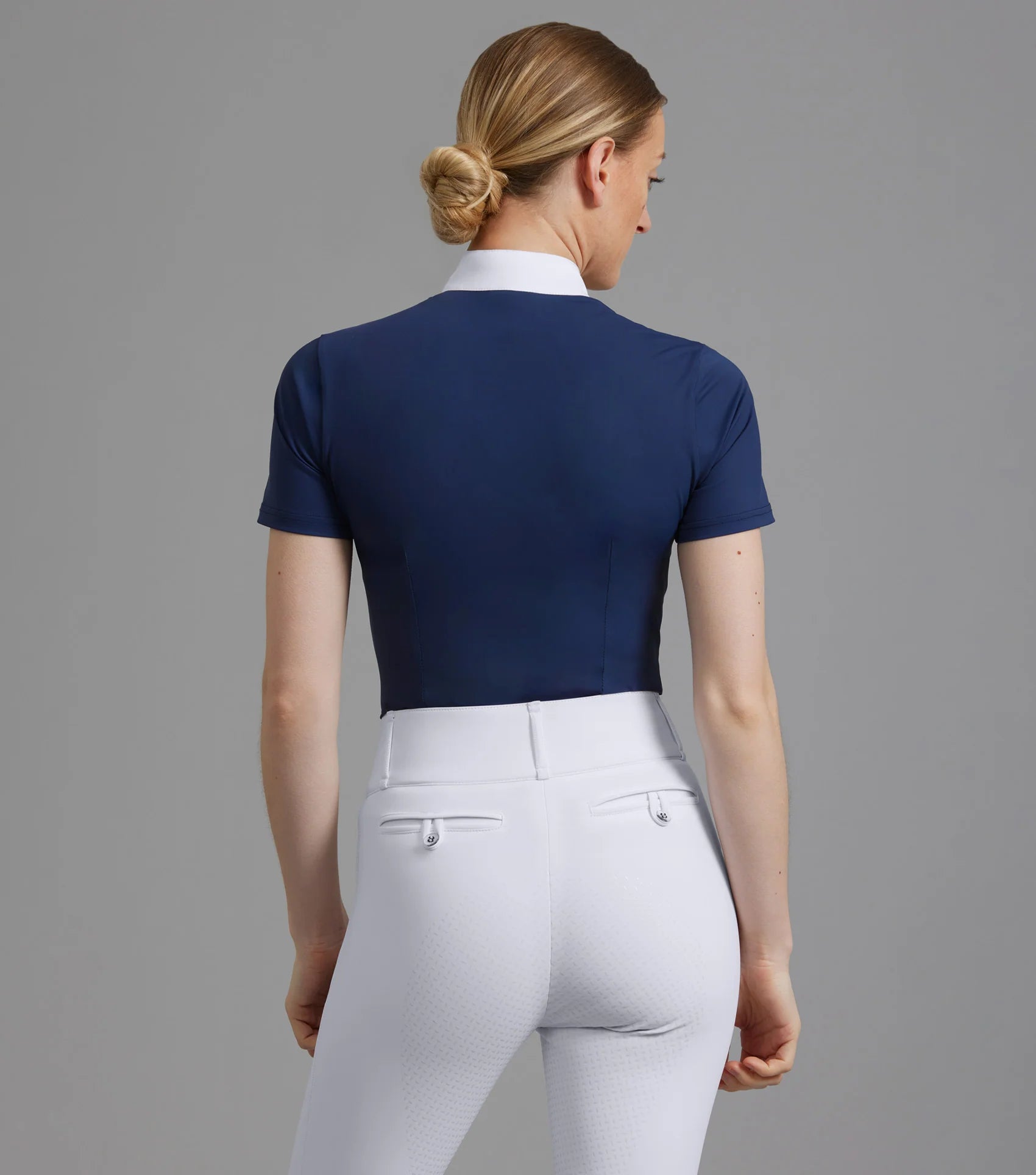 Premier Equine Famosa Navy Equestrian Competition Shirt. Ladies Short Sleeve Horse Riding Apparel at Equiflair. Tailored Fit, White Collar.