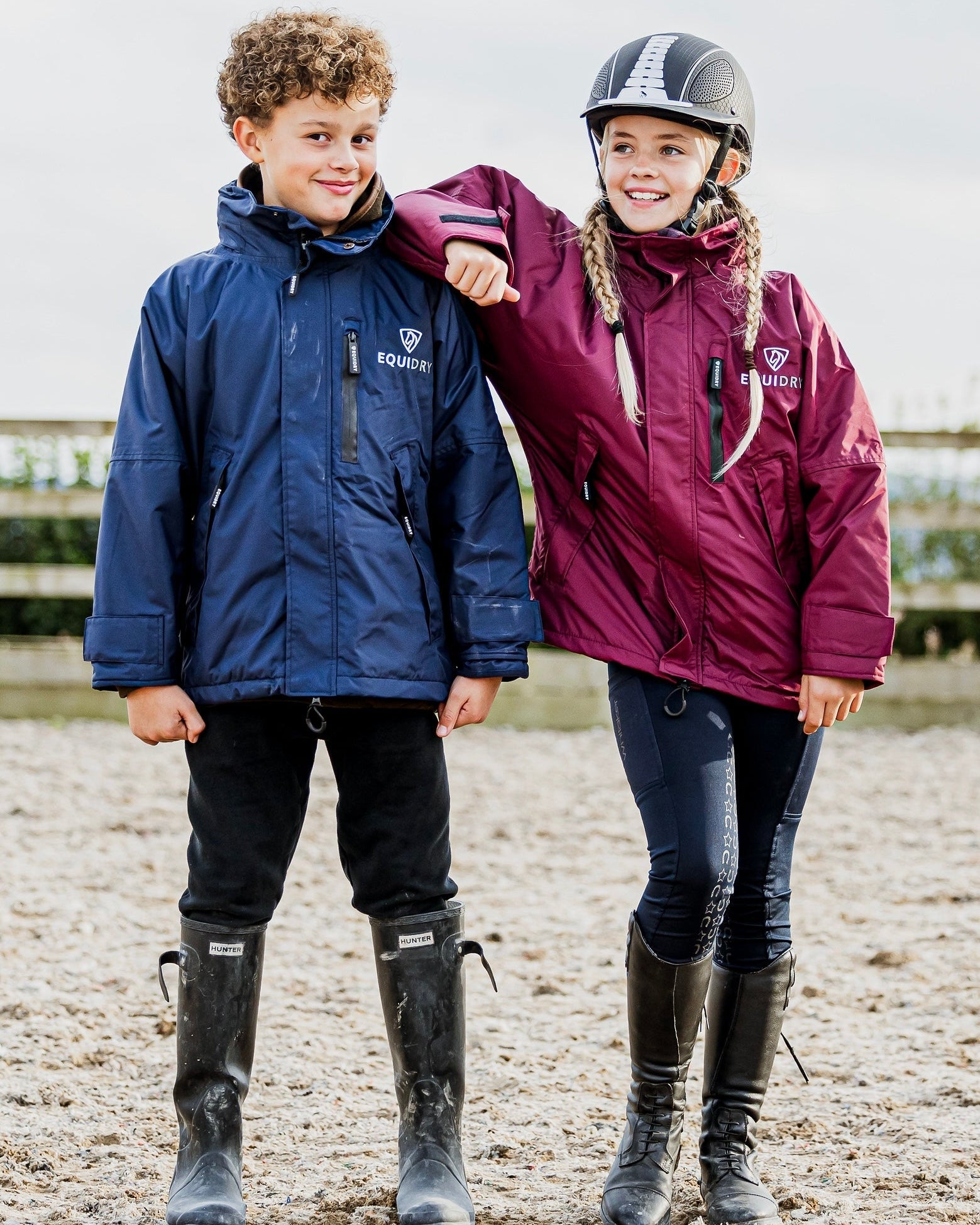 Shortie Child's Oversized Short Waterproof blouson style Riding Jacket Thin Fleece Lining Stowaway Hood in plum and navy in arena