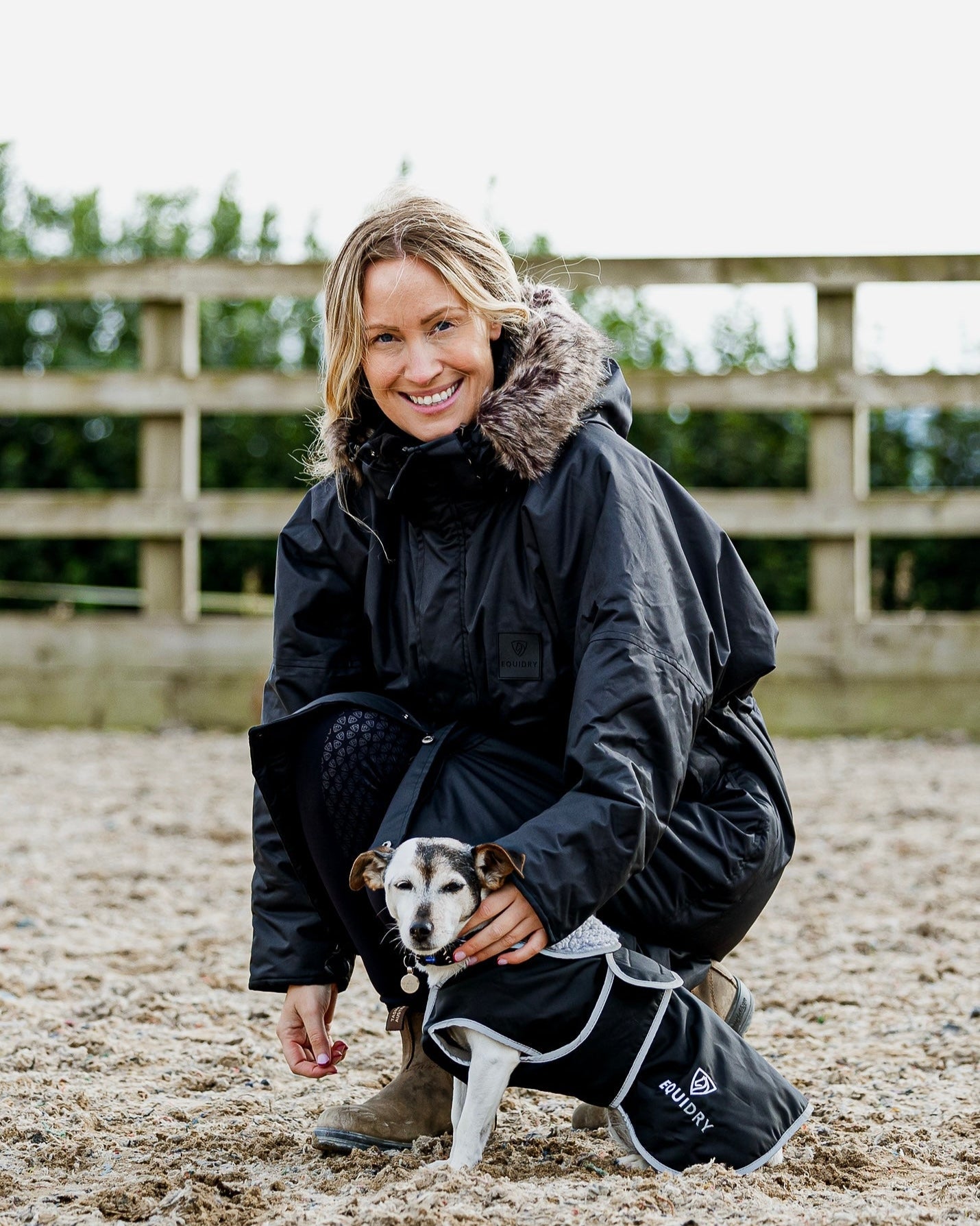 Equiflair EQUIDRY Waterproof Dog Coat Black/Grey with woman and dog on beach