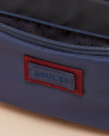JOULES Marlow Navy Crossbody Bag: Stylish nylon bag with adjustable strap, zipped compartments, and branded badge.
