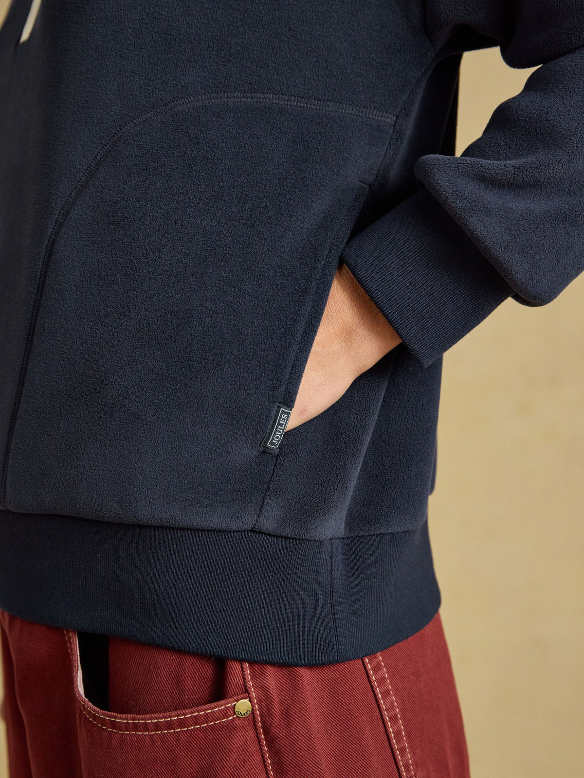 Women's Joules navy quarter zip fleece pullover with funnel neck and side pockets for warm outdoor layering.