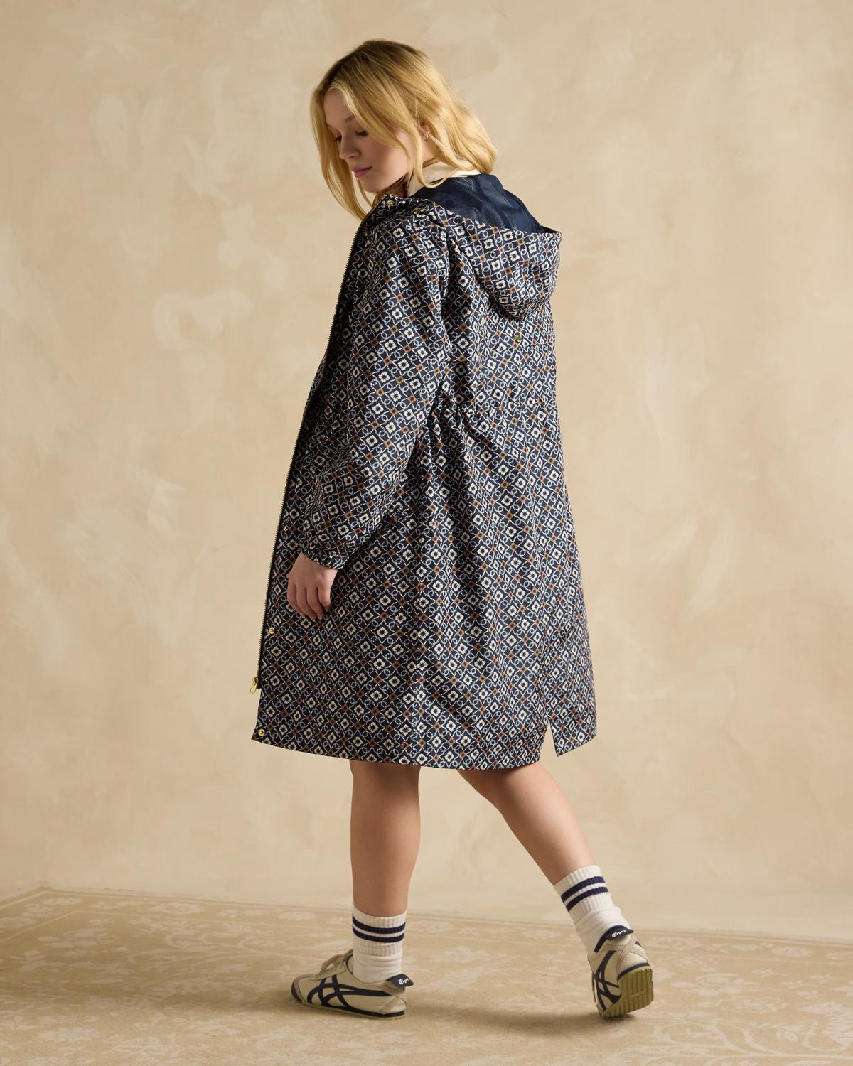 JOULES Holkham Navy Waterproof Packable Raincoat Women's. Geometric pattern coat. Packable, waterproof jacket.